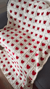 Heart Crochet Blanket - Fall in love with this handmade crochet blanket featuring a beautiful heart motif design. Crafted with care and attention to detail, this cosy blanket is a symbol of warmth, comfort, and love. The crochet stitches form a pattern of heart, creating a stunning visual representation of affection and tenderness. Wrap yourself or a loved one in the heartfelt embrace of this charming crochet creation. Perfect for snuggling up and adding a touch of love to any space. Handmade with care, spreading love one stitch at a time.